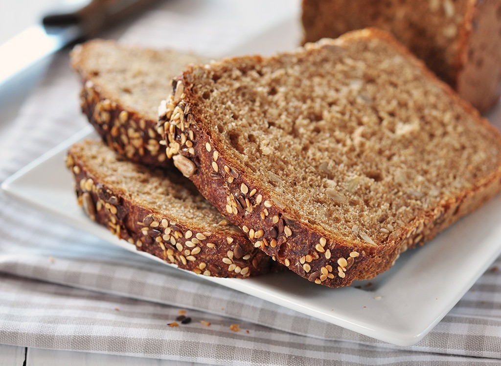 slices of whole grain bread on white plate with checked napkins, state fact about idaho