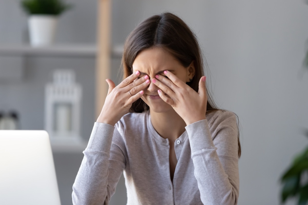 Woman Rubbing Her Eyes