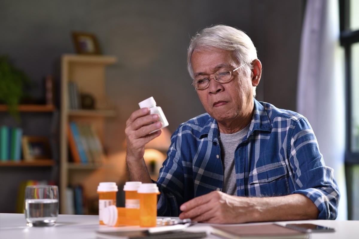 senior man with his medicine bottles