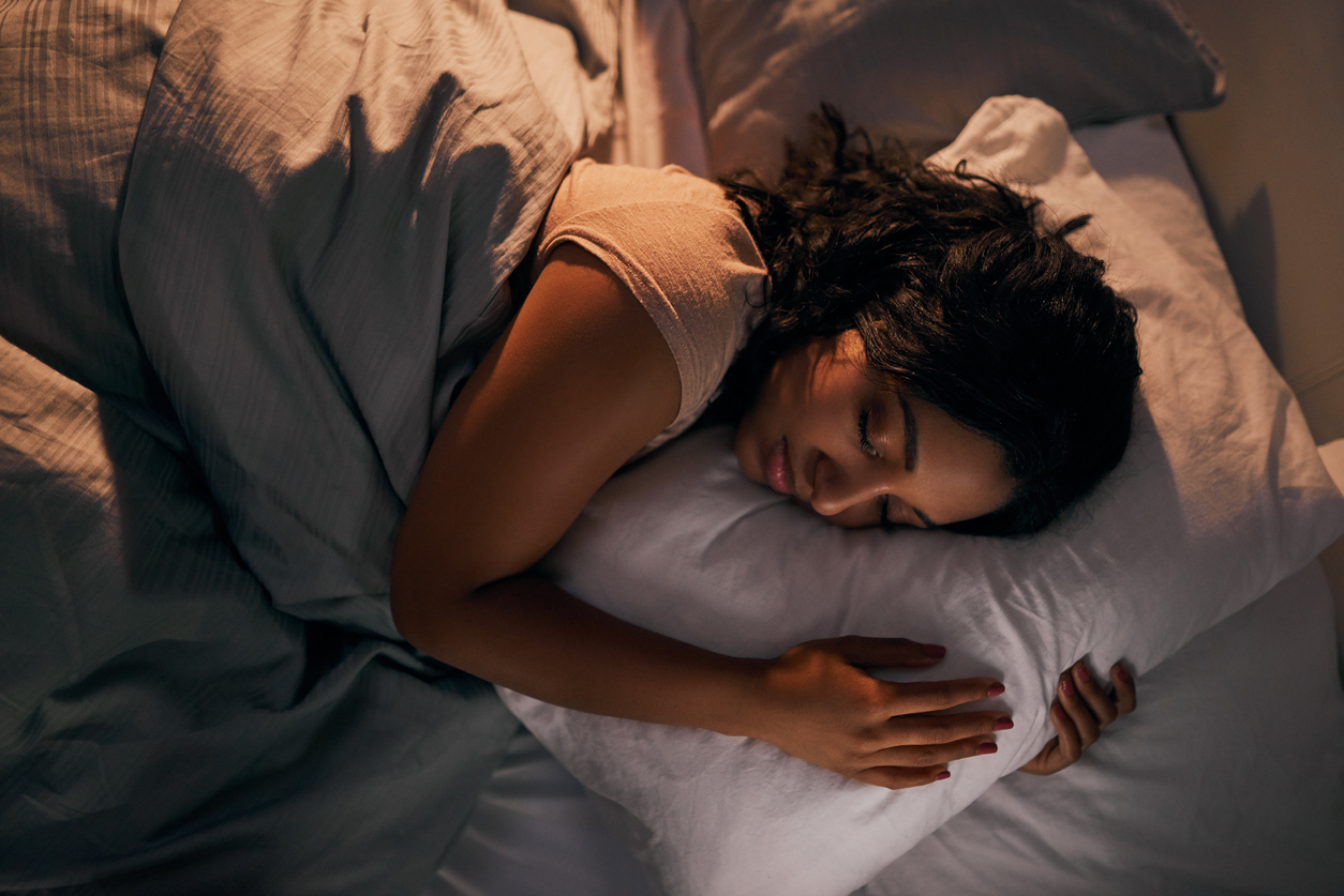 Woman sleeping in bed. 