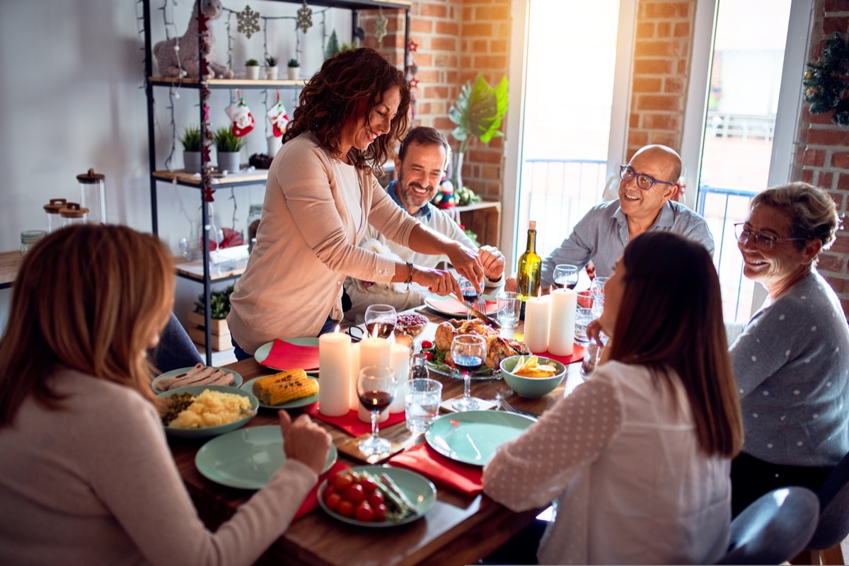 Older group of friends having a dinner party