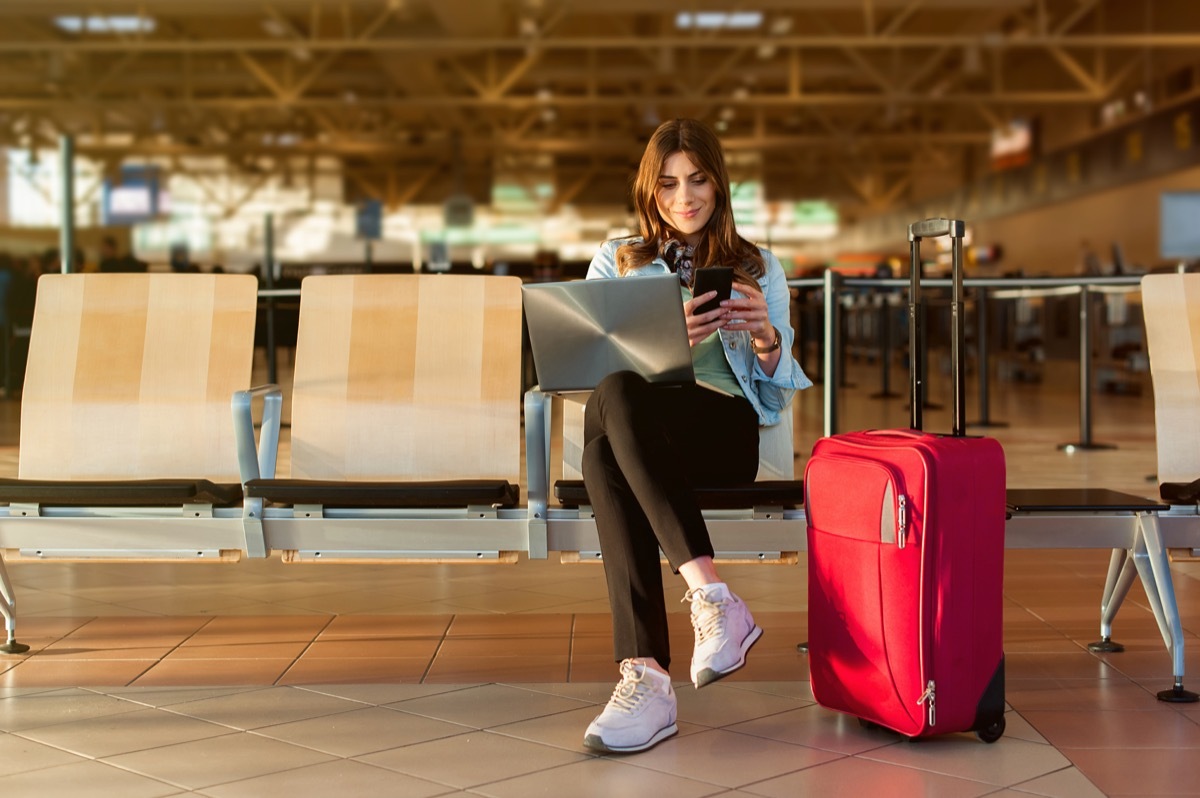 Woman Sitting at the Airport Waiting to Travel {Stay Sane During the Holidays}