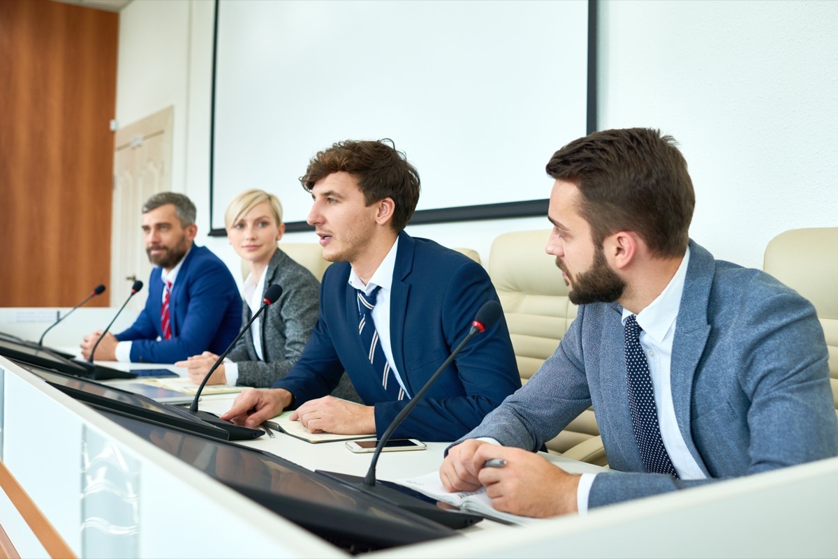 Four Panelists at a Debate