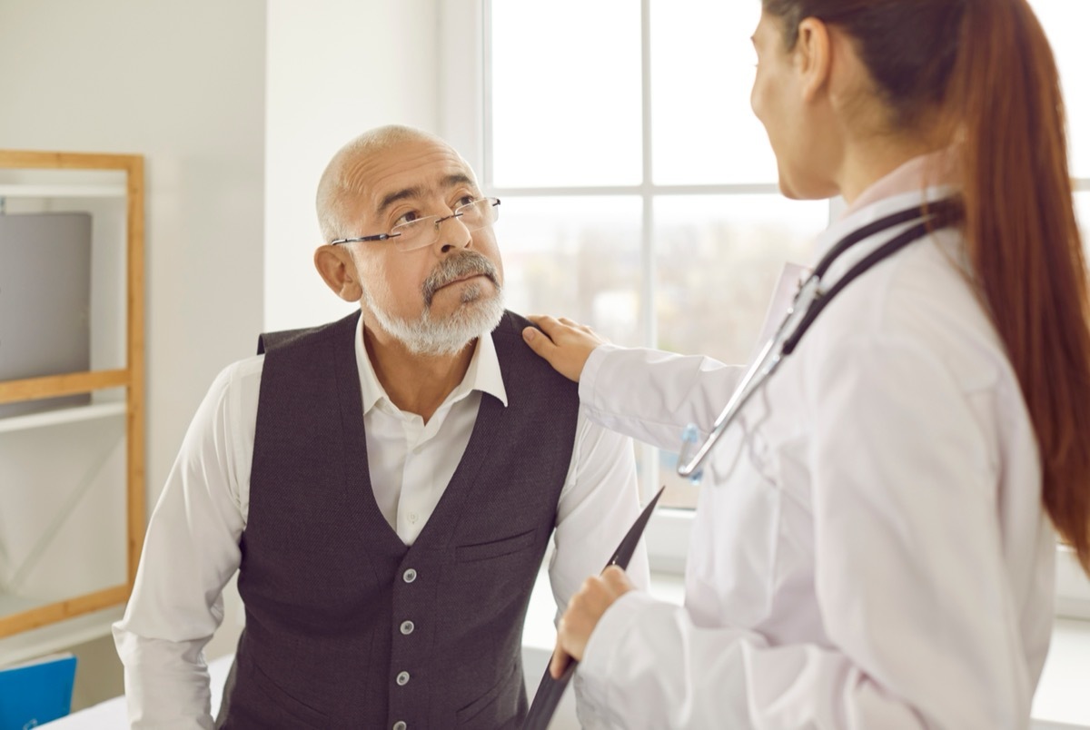 doctor consulting elderly patient