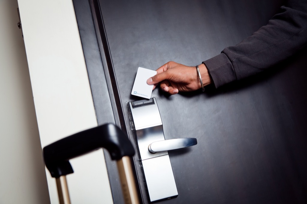 man entering hotel room