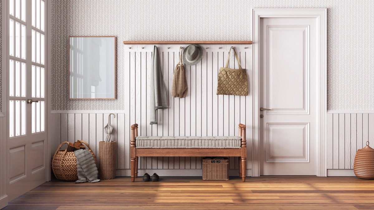 Nordic farmhouse hallway in white and beige tones. Wooden bench and coat rack. Glass, wallpaper and entrance door, scandinavian interior design, 3d illustration