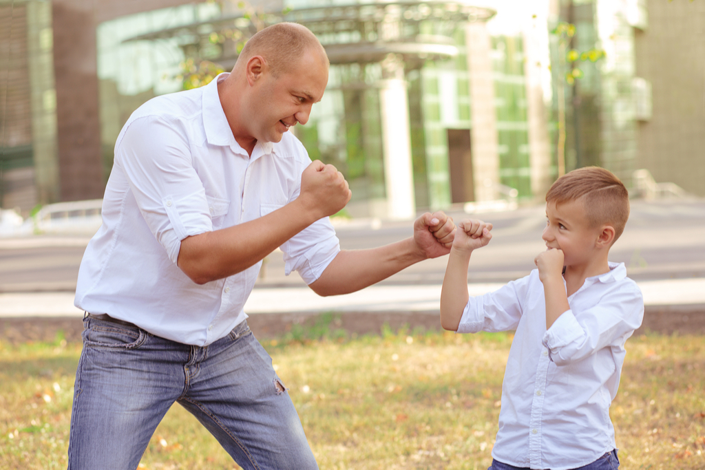 Dad Teaching Son How to Fight