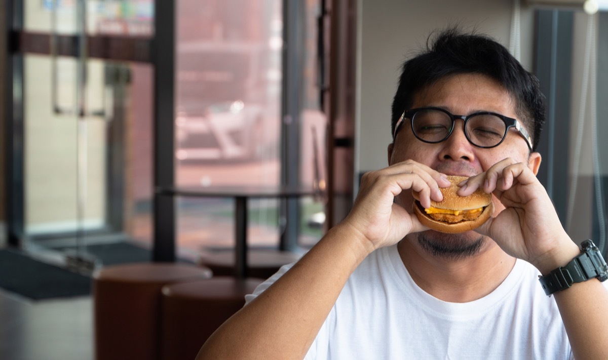 Adult Man Eating a Burger Heart Risk Factors