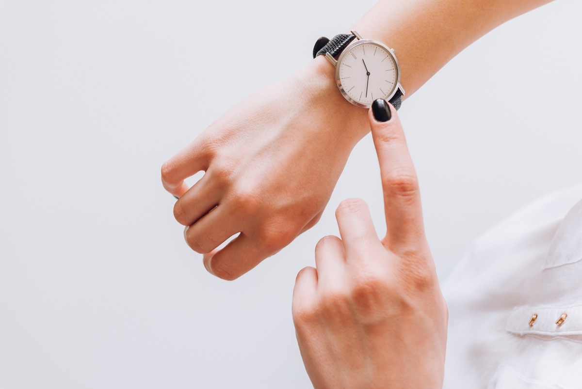 Woman check her watch.