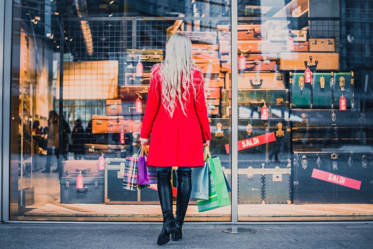 woman looking at shop display