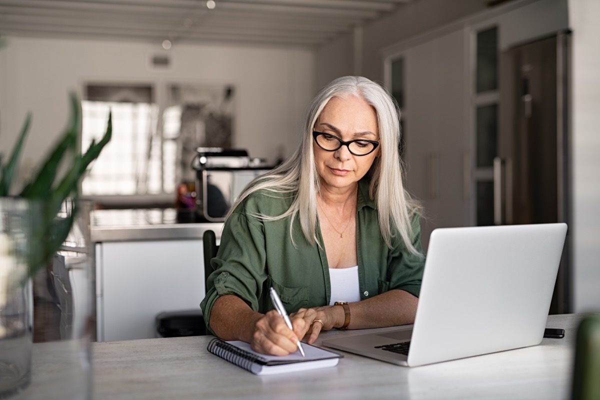 older woman writing list