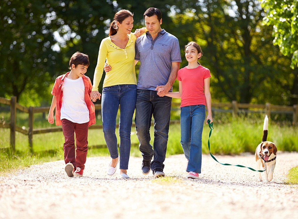 family walking dog happier