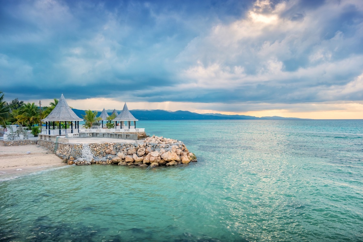 people enjoy boat tour in Montego Bay Jamaica on a cloudy day.