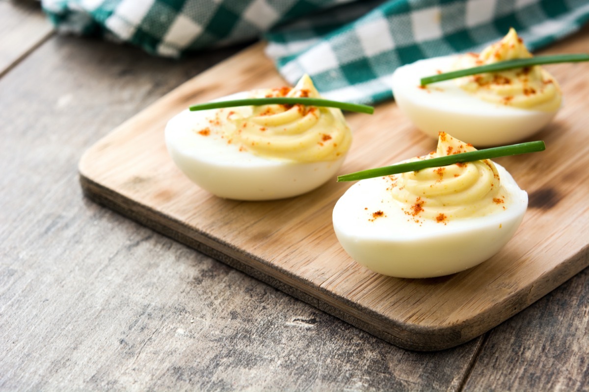 deviled eggs on cutting board