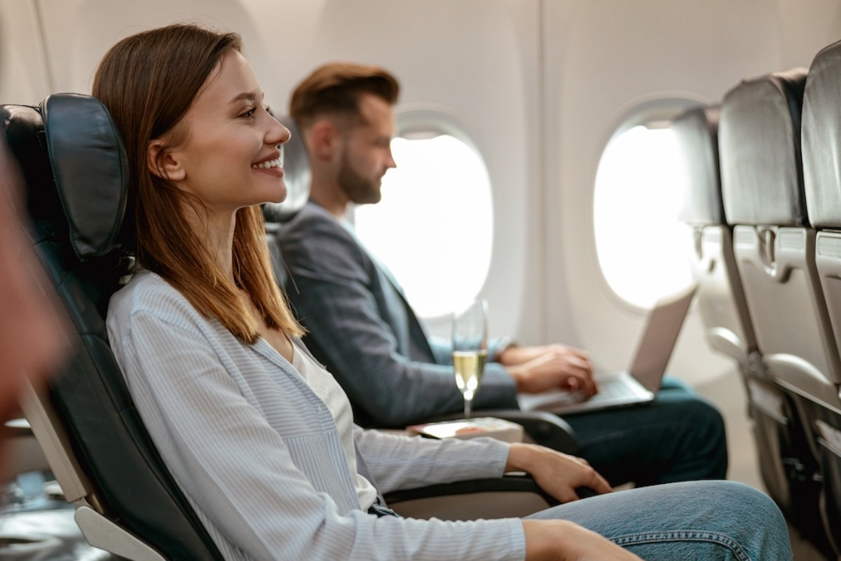 Two passengers on an airplane.