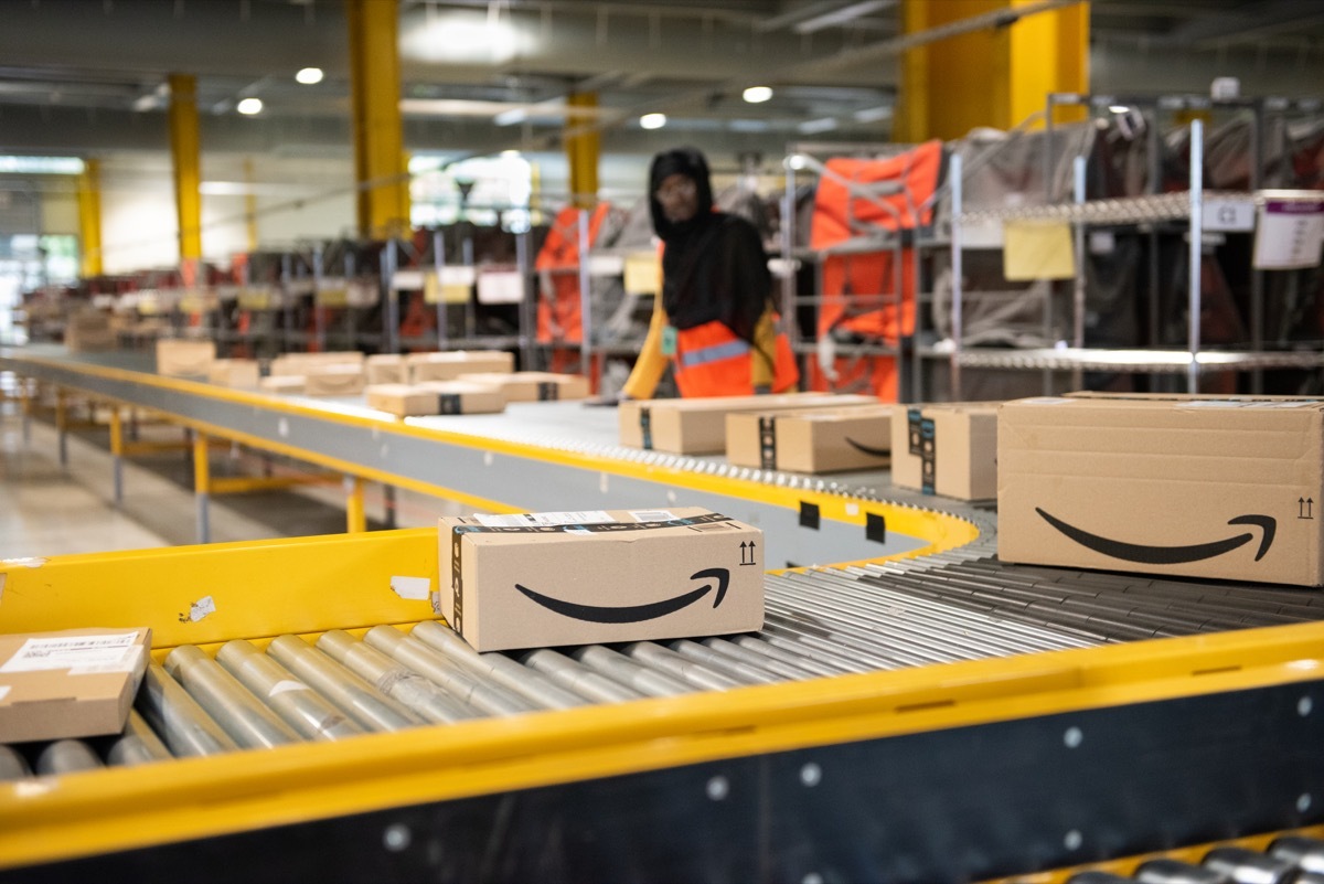 Amazon warehouse with packages on assembly line