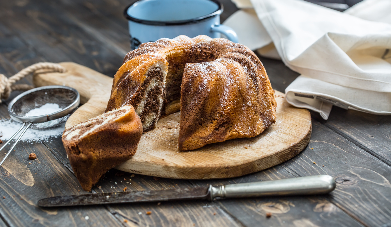 marble bundt cake with powdered sugar topping