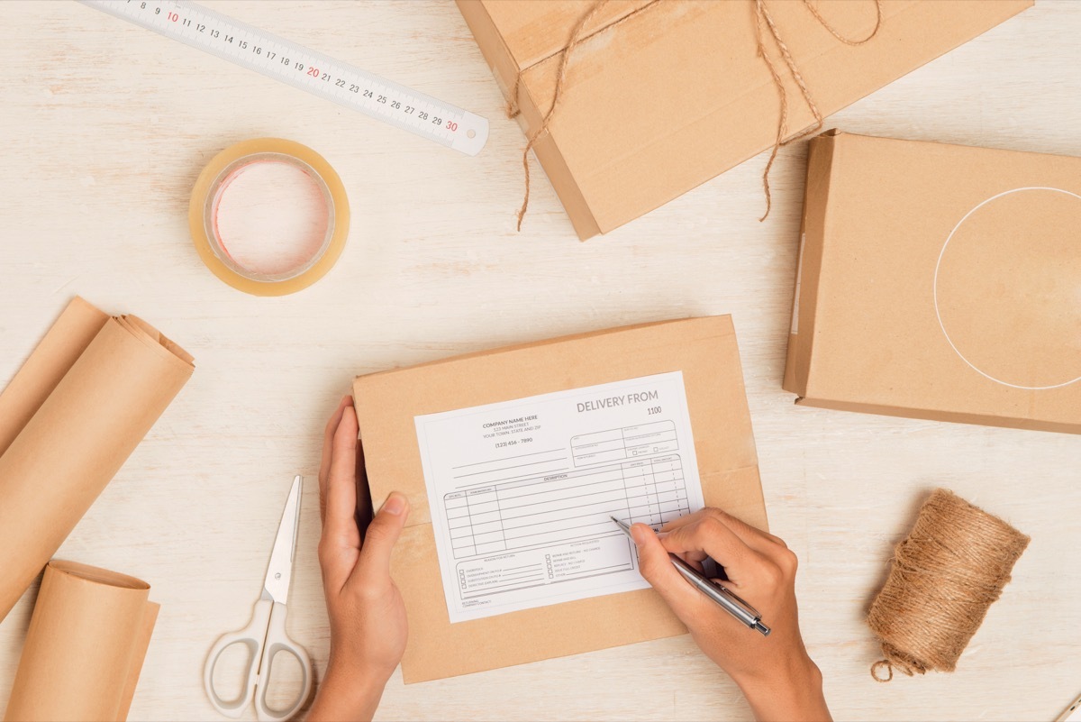 Person Preparing a Return Label For Their Package {Target Shopping Secrets}