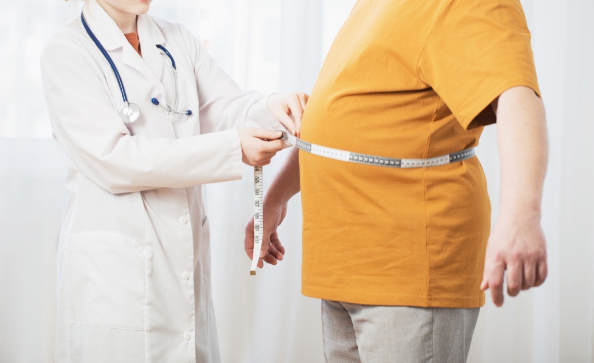 doctor measuring weight loss progress