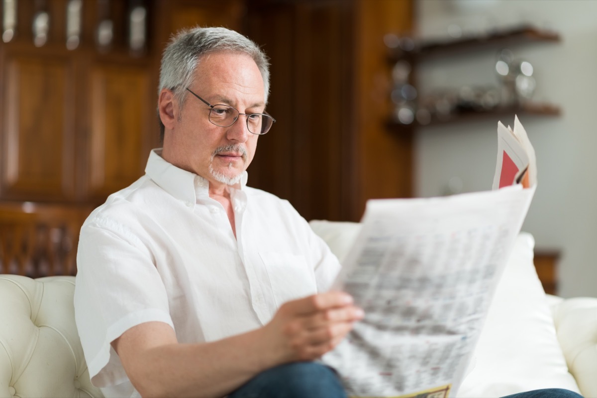 man reading newspaper