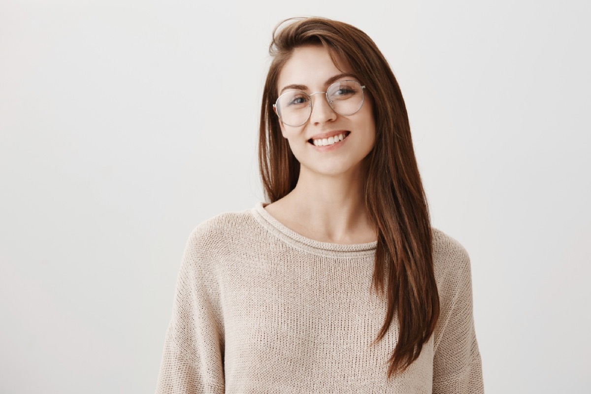 young woman tilting her head to the side, make yourself more attractive