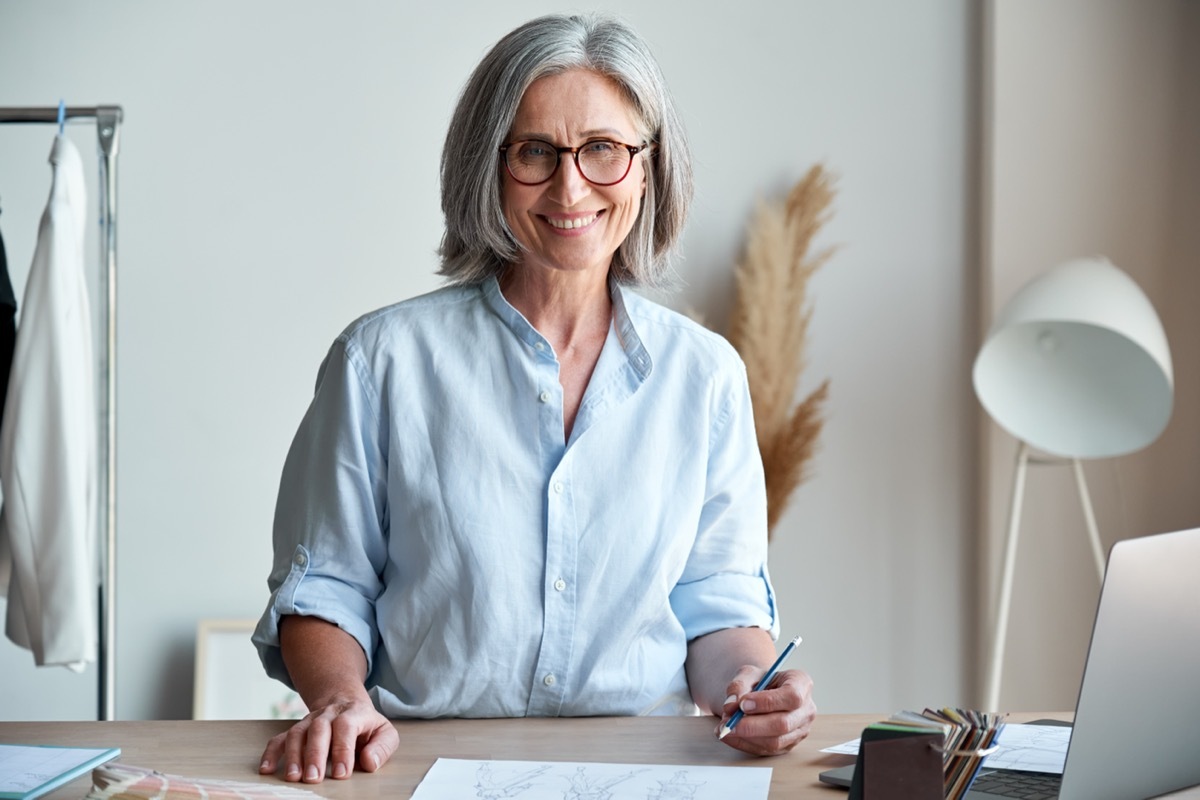 older woman wearing button down blouse