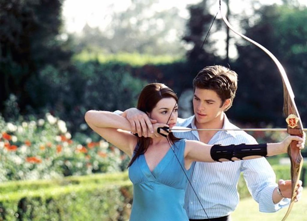 man showing woman archery, how to tell if a girl likes you