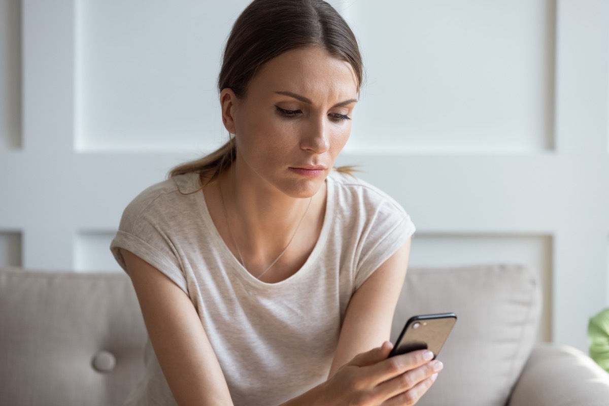 woman using phone to file complaint