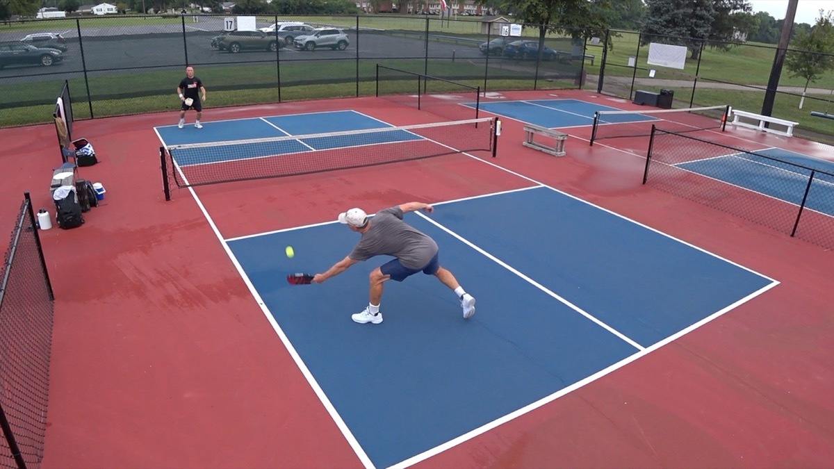 two men playing pickleball