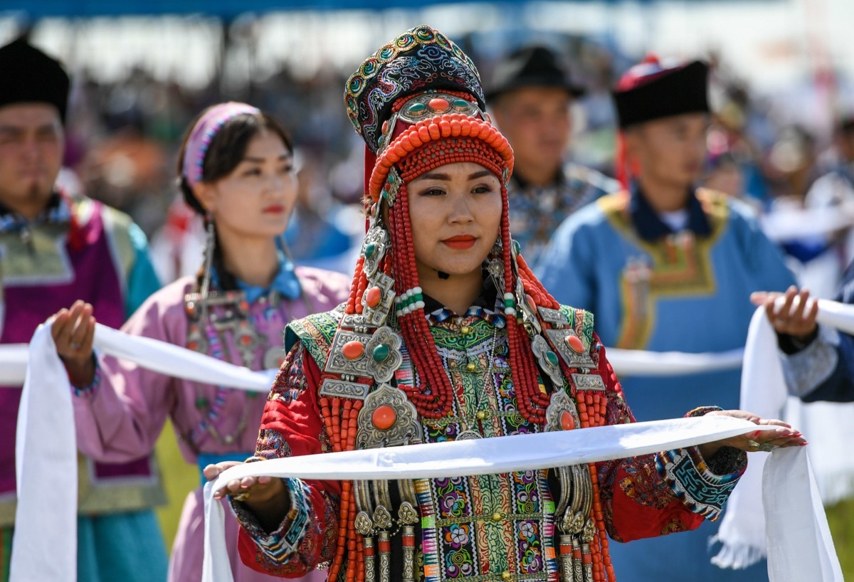 Woman with a hada, or a piece of silk, in Mongolia