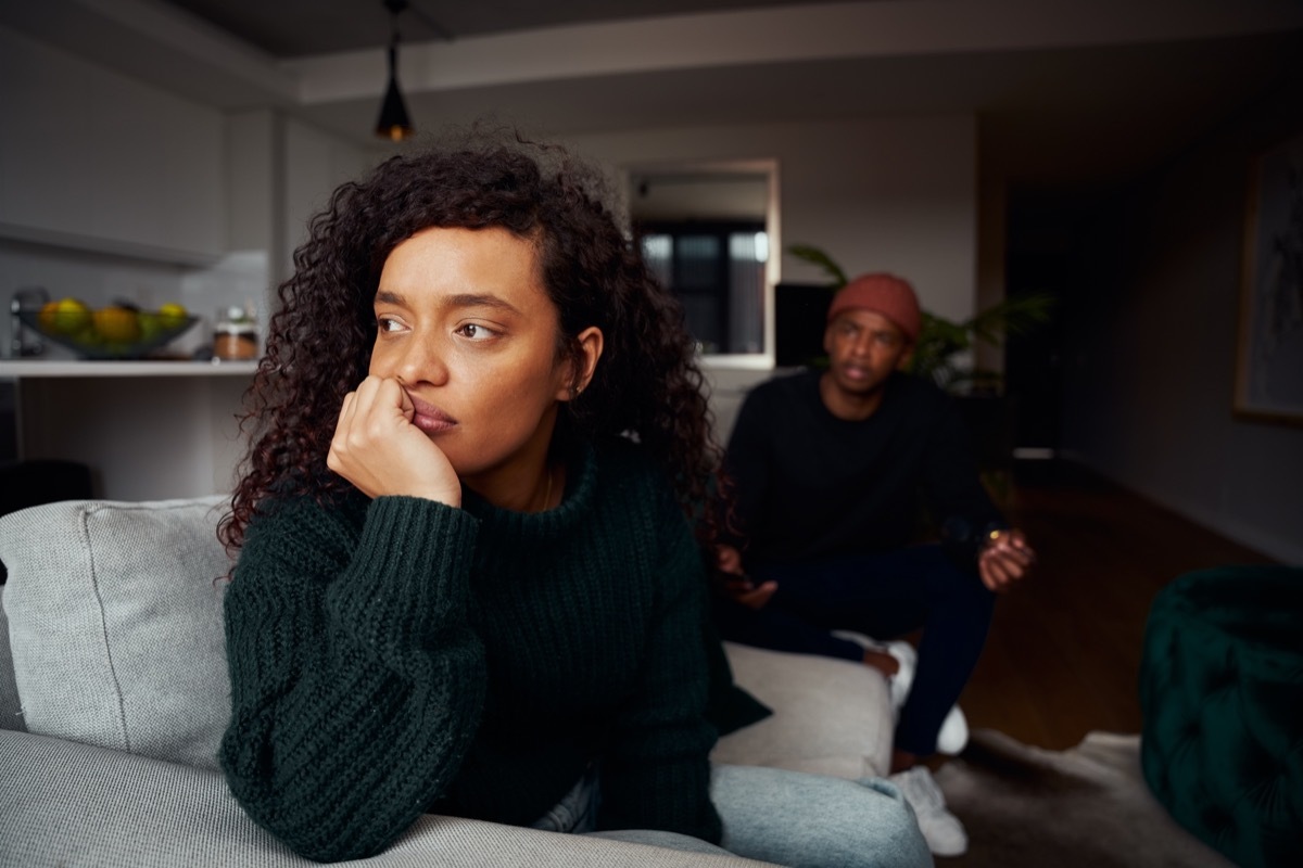 Woman sitting alone fighting with her partner.