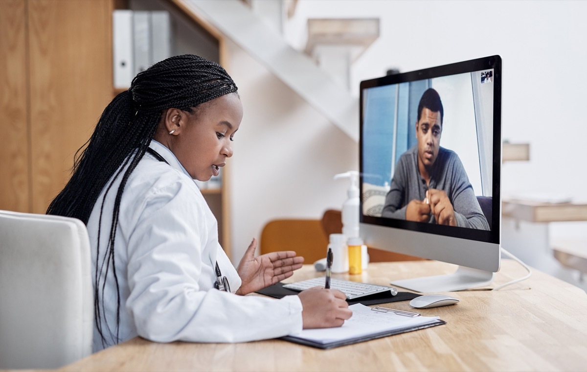 doctor writing prescription virtually