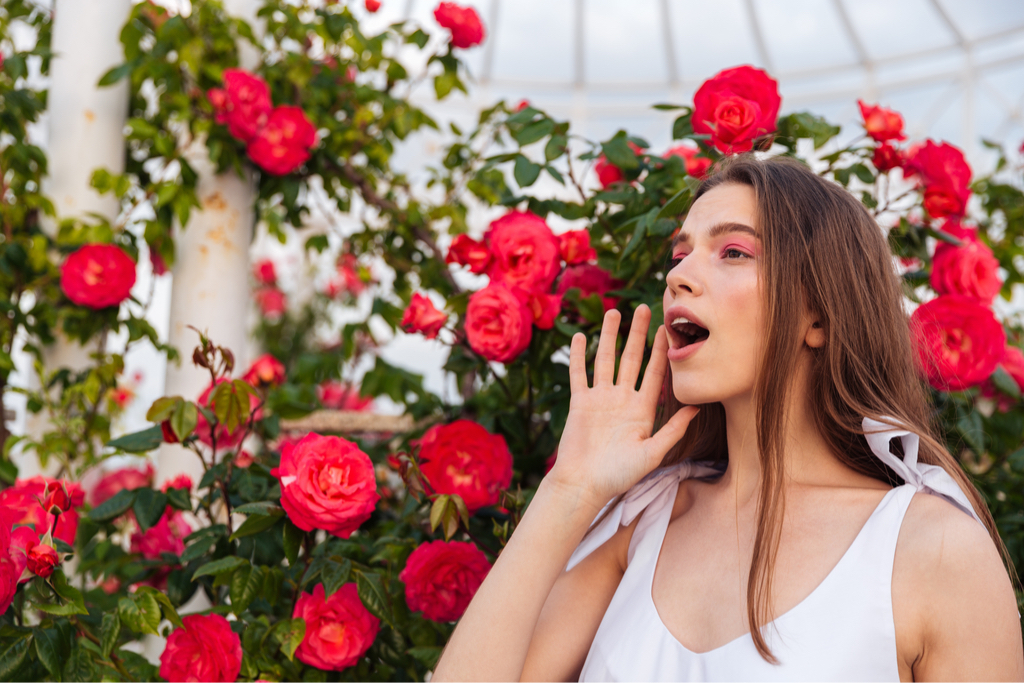 Woman in garden calling for someone