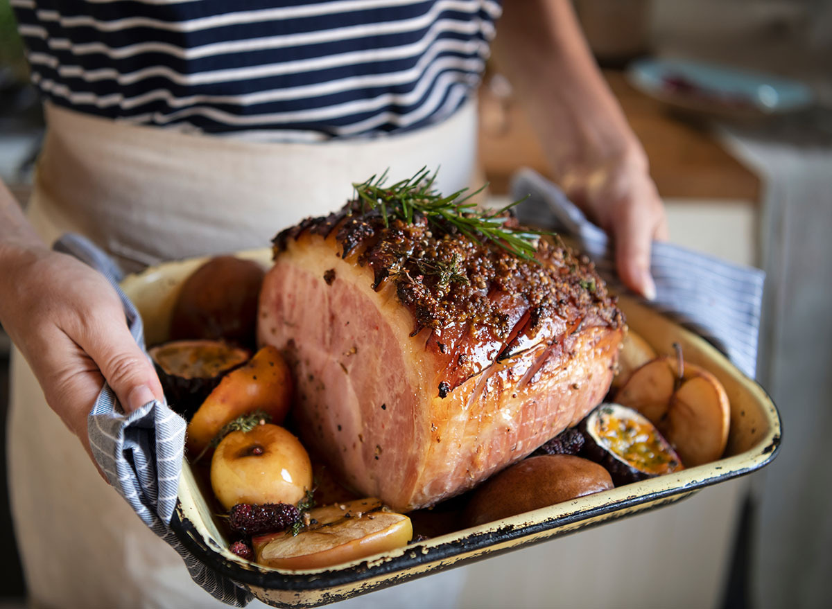 roasted ham being served in dish