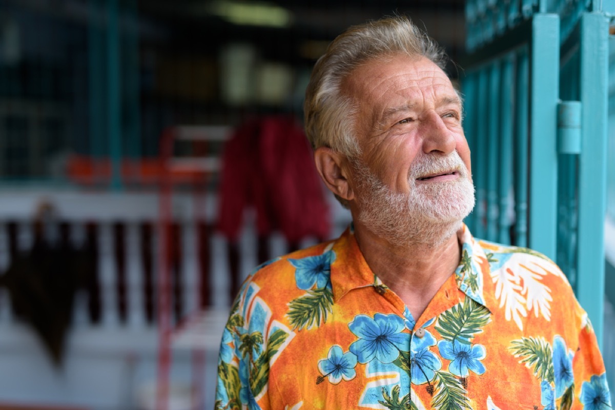 older man wearing orange floral shirt, relationship white lies