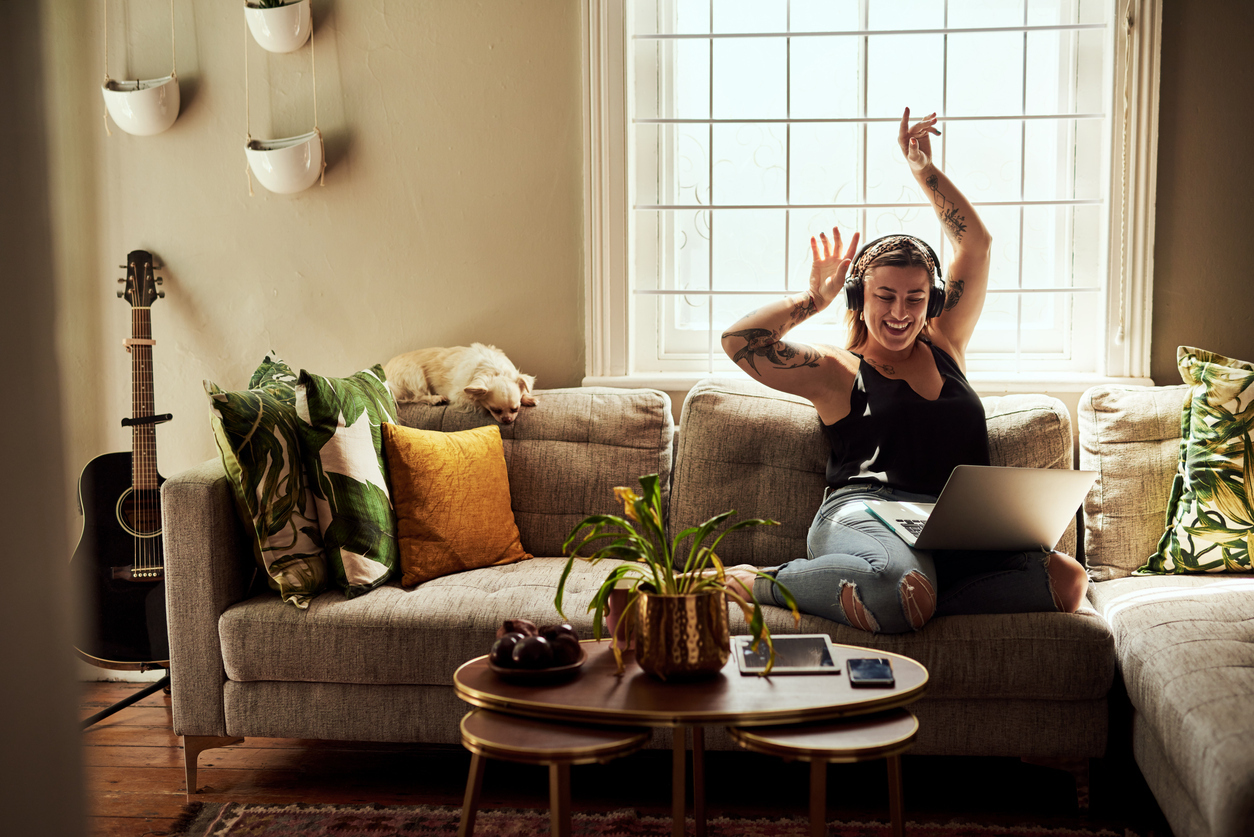 young woman listening to music at home