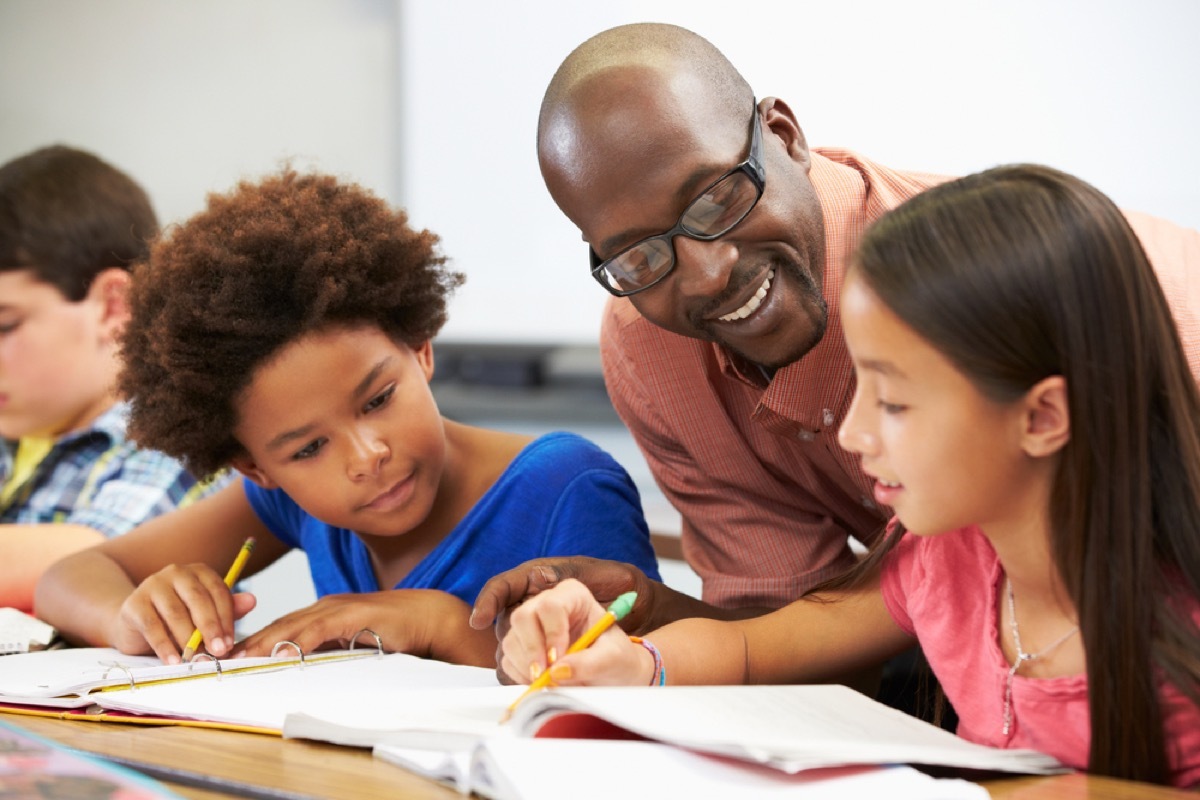 teacher helping students back-to-school tips