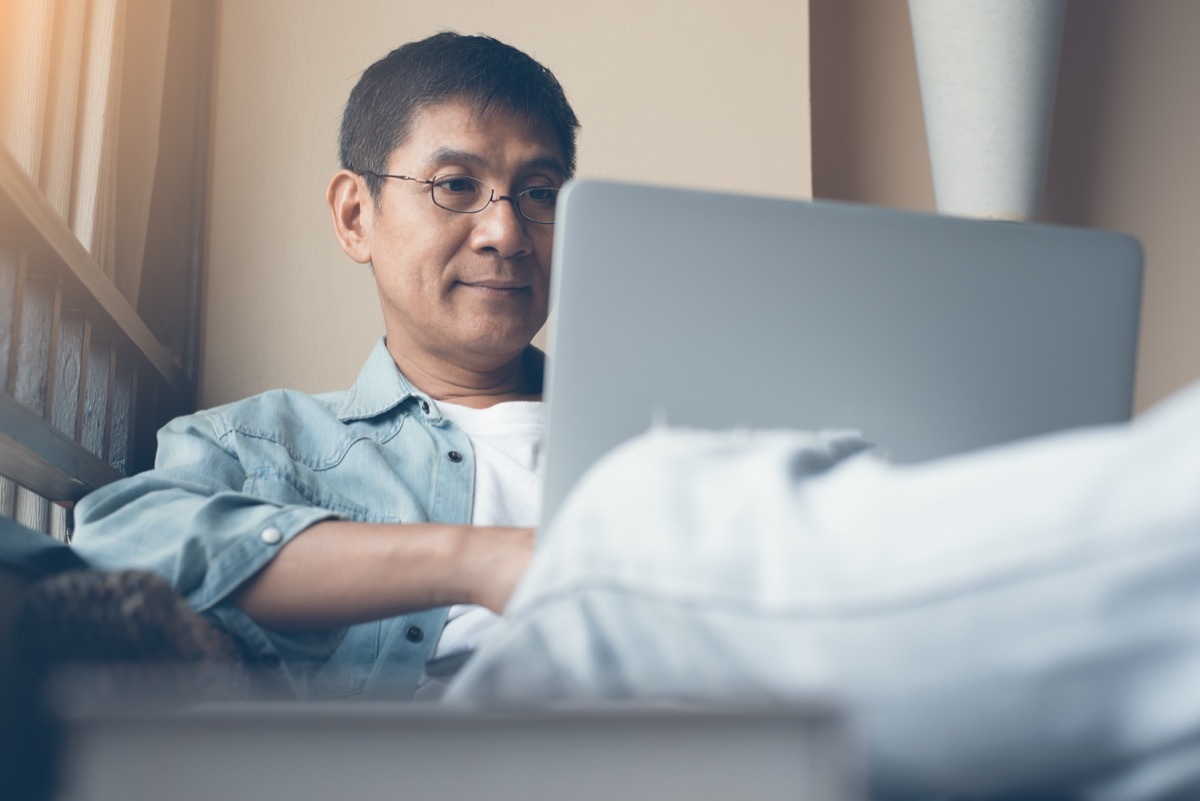 Man looking at his laptop