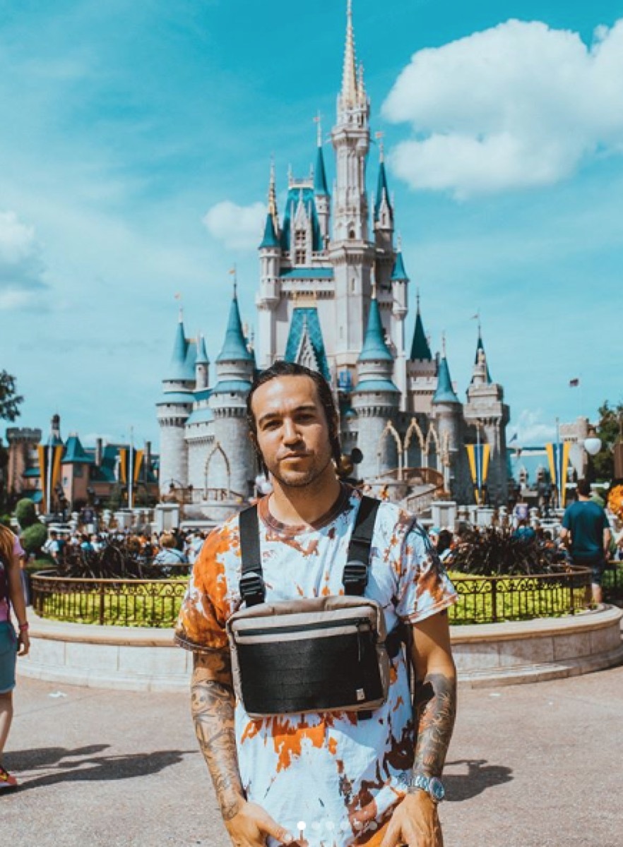 pete wentz at disney world in front of castle, disney celebs