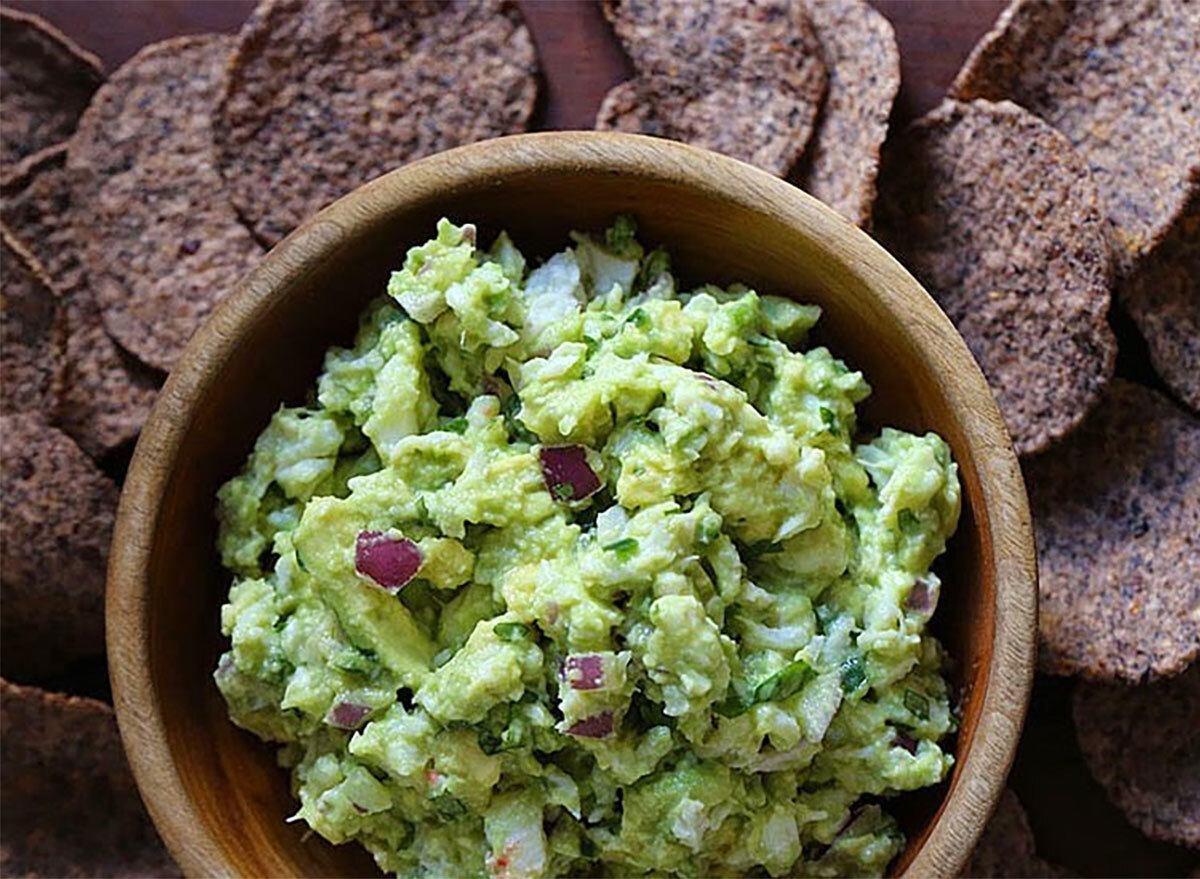 crab guacamole in bowl with chips