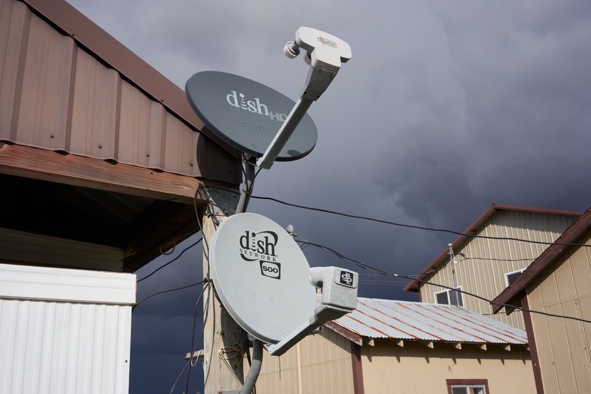 Parkdale, Oregon, USA - Oct 26, 2019: DISH satellite TV antennas are seen in a farm. DISH Network Corporation is a U.S. television provider.