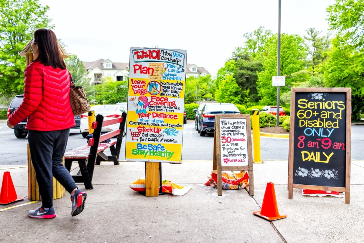 Trader Joe's grocery store sign for senior disabled customers special morning hours, people limit and grocery bagging paper bag restriction at covid-19 coronavirus