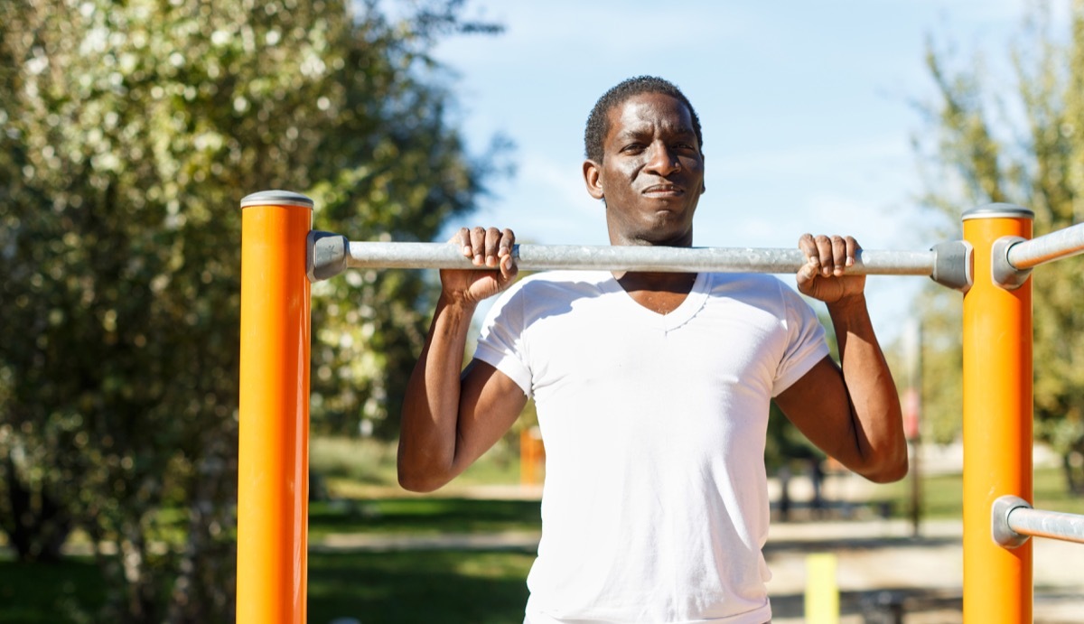 senior man doing pull ups