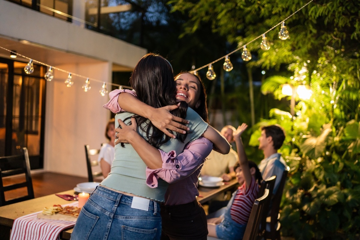 Friends Hugging in the Yard