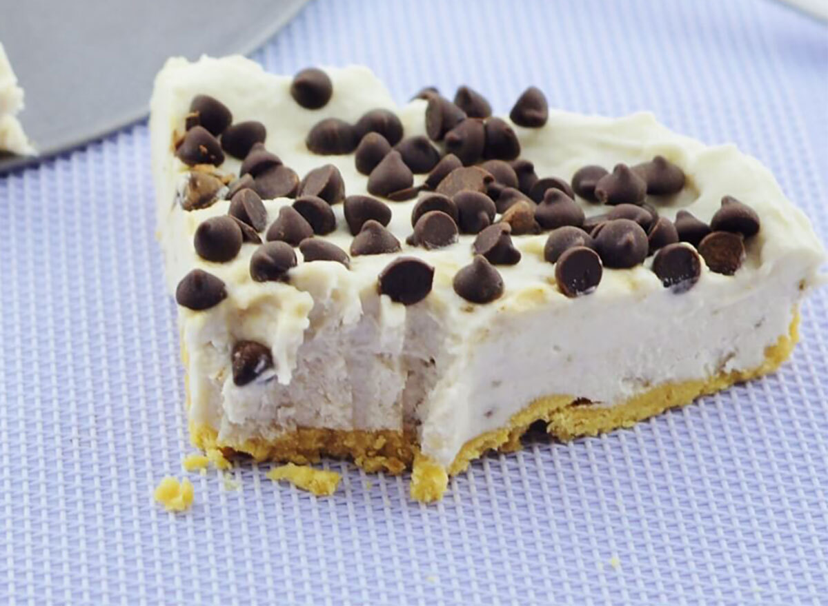 slice of vegan coconut banana cheesecake topped with chocolate chips