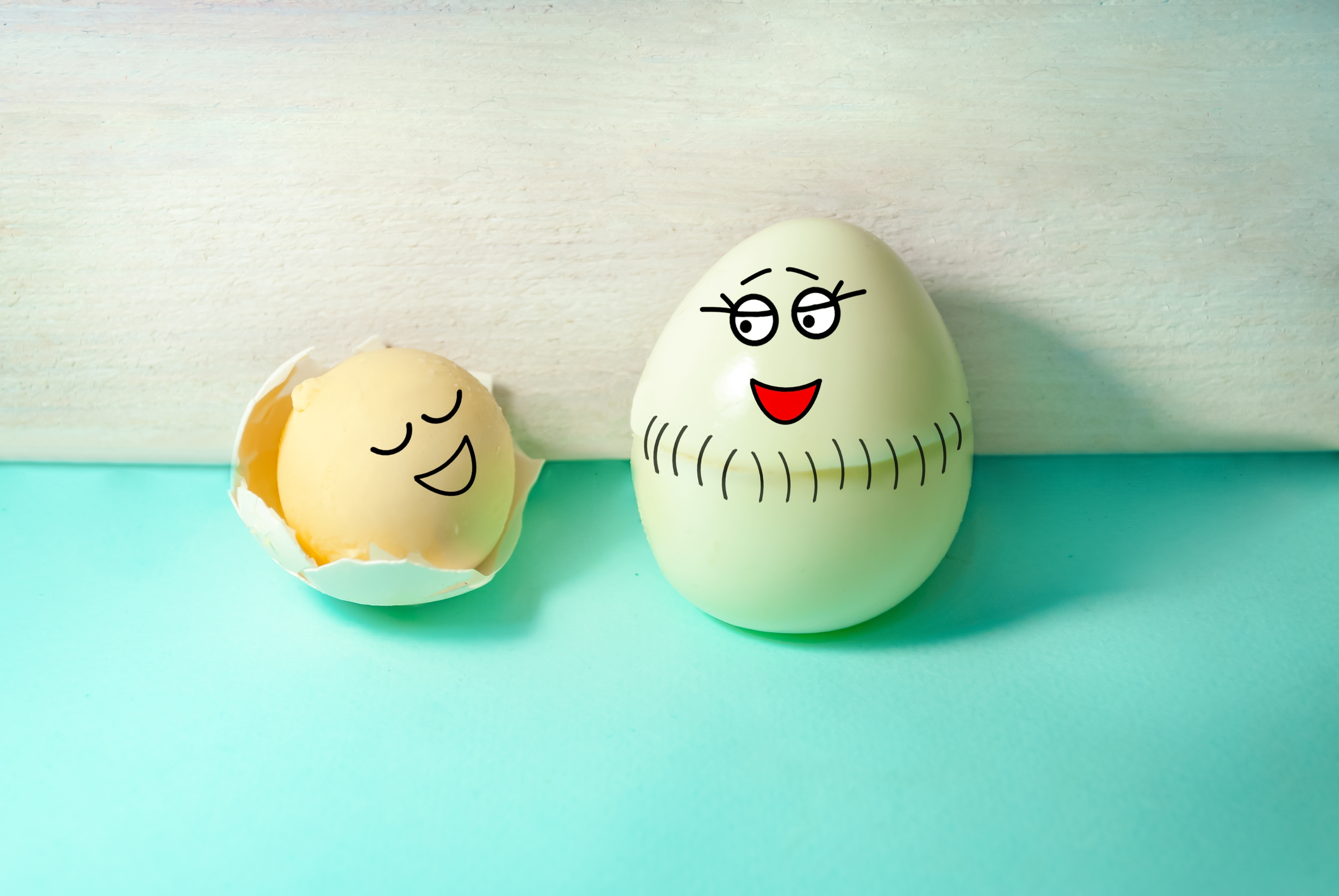 funny scene - mother egg gives birth to baby yolk