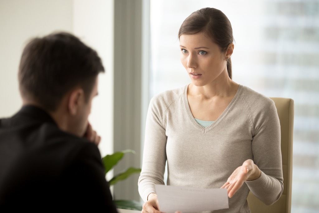 Woman is confronting her boss at work.