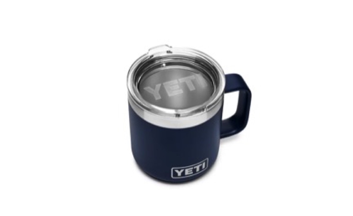 blue yeti rambler mug with silver lid and handle on white background