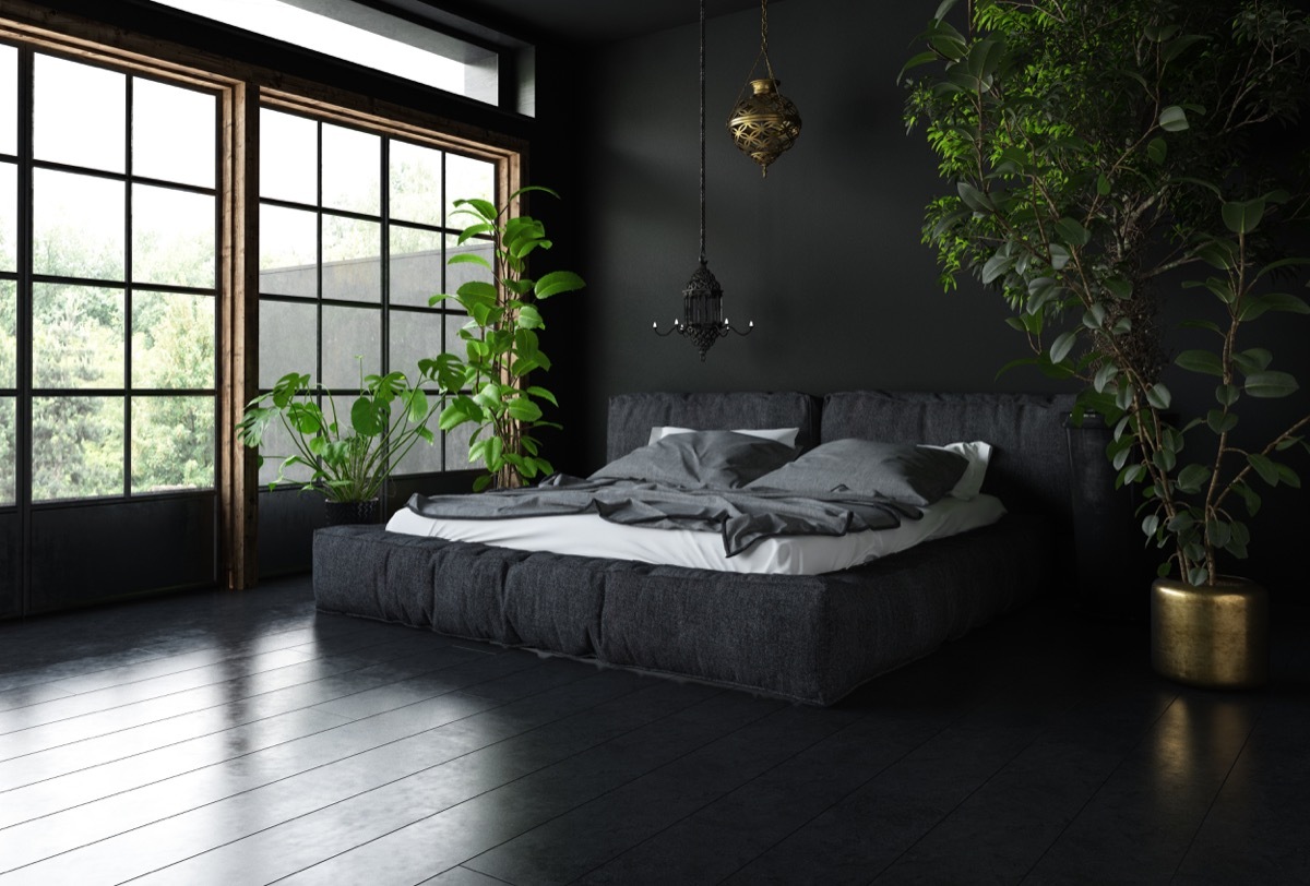 bedroom with dark floor and furniture