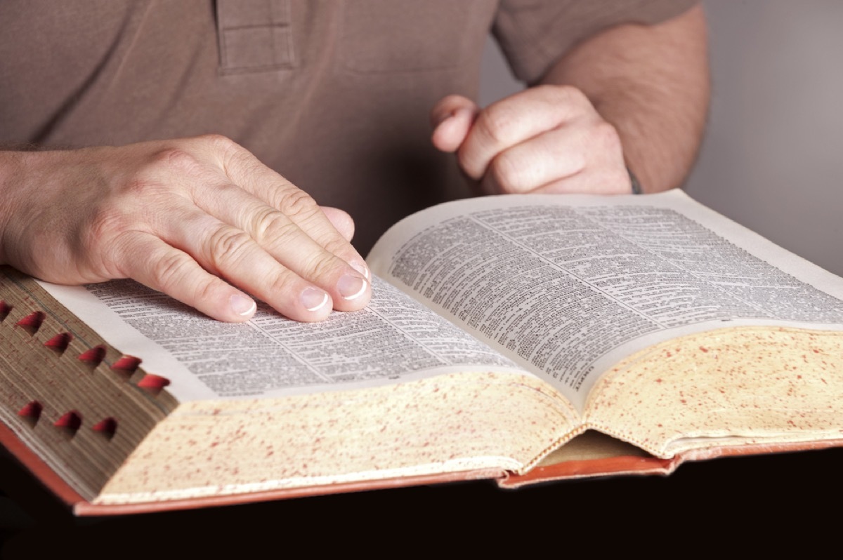 Man reading dictionary